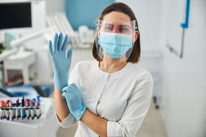 Why do I need to clean my hands both before and after glove use?
