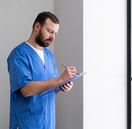 Male Nurse writing